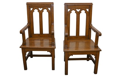 Lot 132 - A PAIR OF EARLY 20TH CENTURY ECCLESIASTICAL OAK ARMCHAIRS