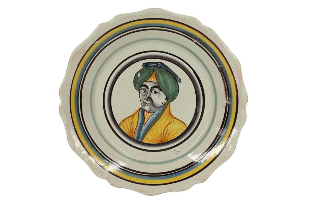 Lot 715 - A NEVERS FAIENCE POTTERY DISH DEPICTING AN OTTOMAN SULTAN