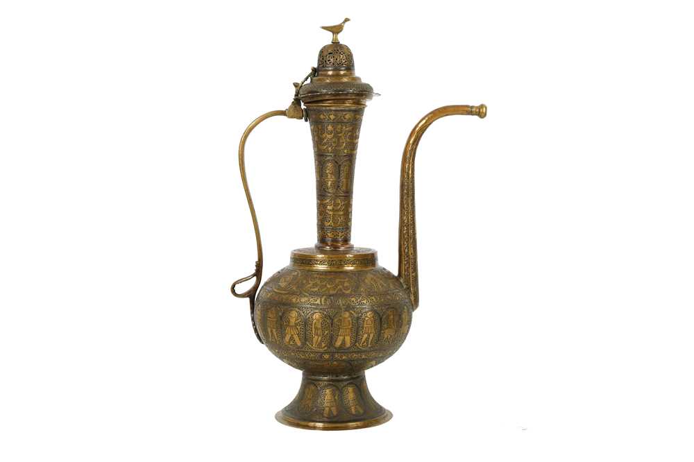 Lot 623 - A ZAND-STYLE SILVER-INLAID BRASS EWER MADE FOR THE IRANIAN MARKET