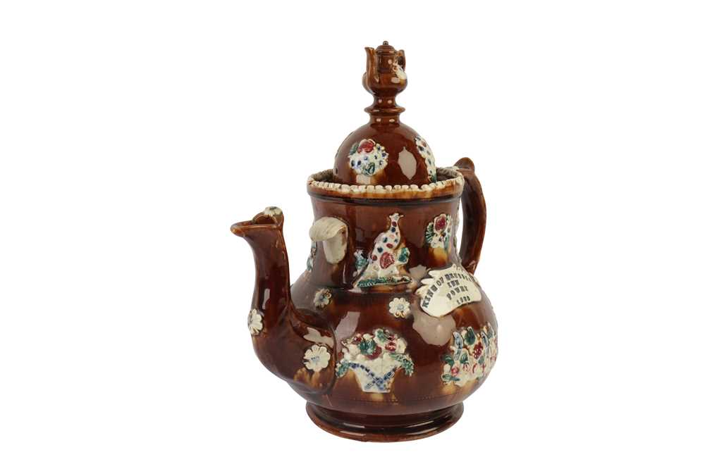 Lot 382 - A VICTORIAN TREACLE GLAZED BARGEWARE TEAPOT