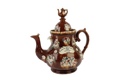 Lot 382 - A VICTORIAN TREACLE GLAZED BARGEWARE TEAPOT