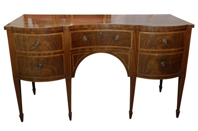 Lot 175 - AN EARLY 19TH CENTURY STRUNG MAHOGANY AND CROSSBANDED CONCAVE FRONTED SIDEBOARD