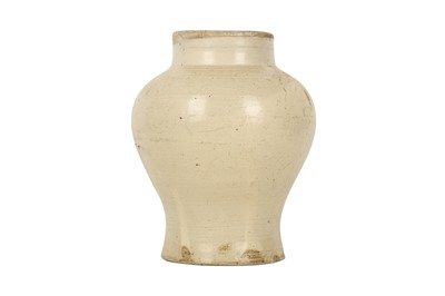 Lot 758 - A CHINESE CREAM-GLAZED POTTERY VASE.