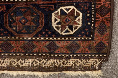Lot 54 - AN ANTIQUE BALOUCH MAT AND TURKMENISTAN ANIMAL TRAPPING