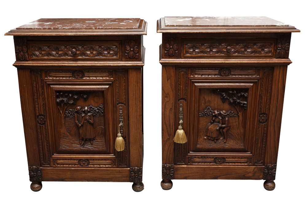 Lot 636 - A PAIR OF CONTINENTAL CARVED ELM BEDSIDE CABINETS
