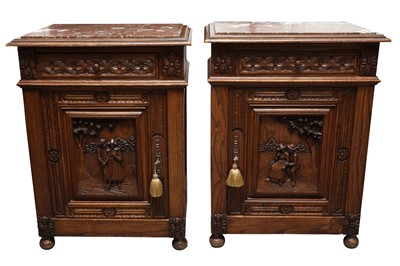 Lot 195 - A PAIR OF CONTINENTAL CARVED ELM BEDSIDE CABINETS