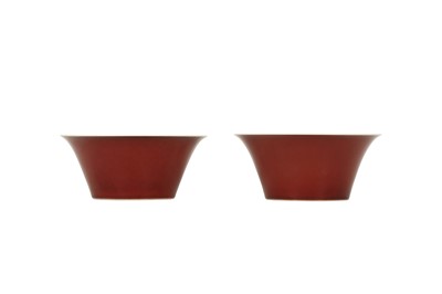 Lot 427 - A PAIR OF CHINESE COPPER RED-GLAZED BOWLS.