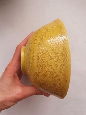 Lot 966 - A CHINESE YELLOW-GLAZED 'DRAGON' BOWL.