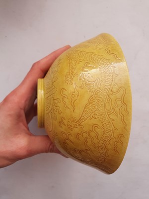 Lot 966 - A CHINESE YELLOW-GLAZED 'DRAGON' BOWL.
