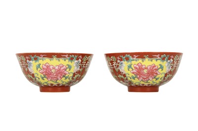 Lot 428 - A PAIR OF CHINESE CORAL-GROUND FAMILLE ROSE BOWLS.