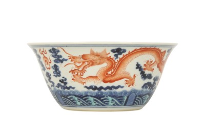 Lot 974 - A CHINESE BLUE AND WHITE AND IRON-RED 'DRAGON' BOWL.