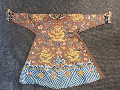 Lot 289 - A CHINESE CHESTNUT-GROUND EMBROIDERED 'DRAGON' ROBE.