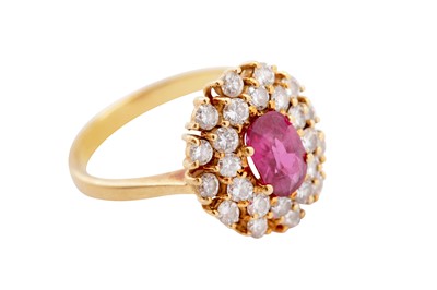 Lot 95 - A ruby and diamond cluster ring