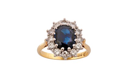 Lot 23 - A sapphire and diamond cluster ring