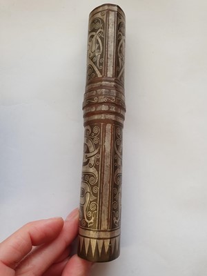 Lot 354 - A CHINESE BRONZE SILVER-INLAID FITTING.