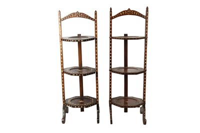 Lot 724 - λ A NEAR PAIR OF HARDWOOD IVORY-INLAID ANGLO-INDIAN TIERED TEA TRAYS