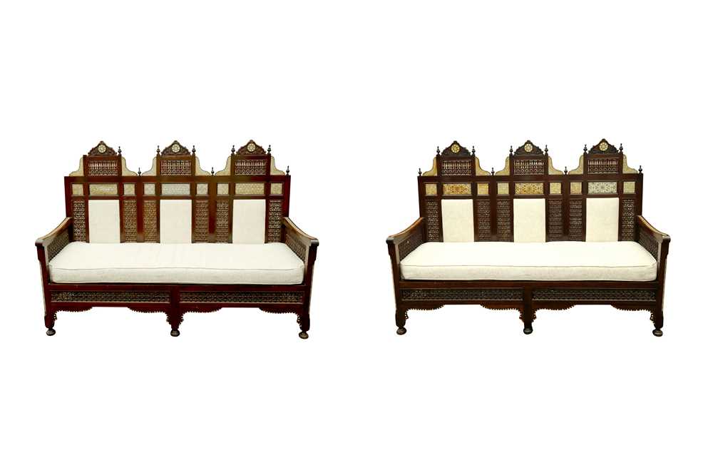 Lot 637 - λ A NEAR PAIR OF MOTHER-OF-PEARL AND BONE-INLAID ORIENTALIST MASHRABIYA-STYLE SETTEES