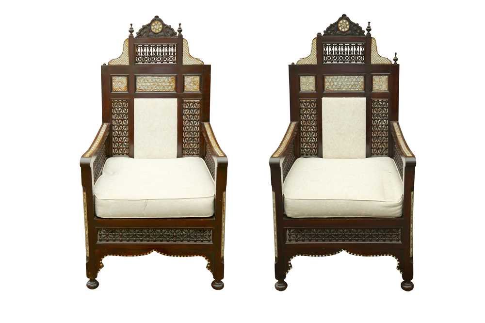 Lot 633 - λ A PAIR OF MOTHER-OF-PEARL AND BONE-INLAID ORIENTALIST MASHRABIYA-STYLE ARMCHAIRS