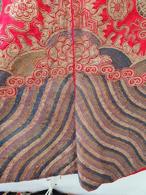 Lot 378 - A CHINESE RED-GROUND EMBROIDERED SILK 'DRAGON AND PHOENIX' JACKET.