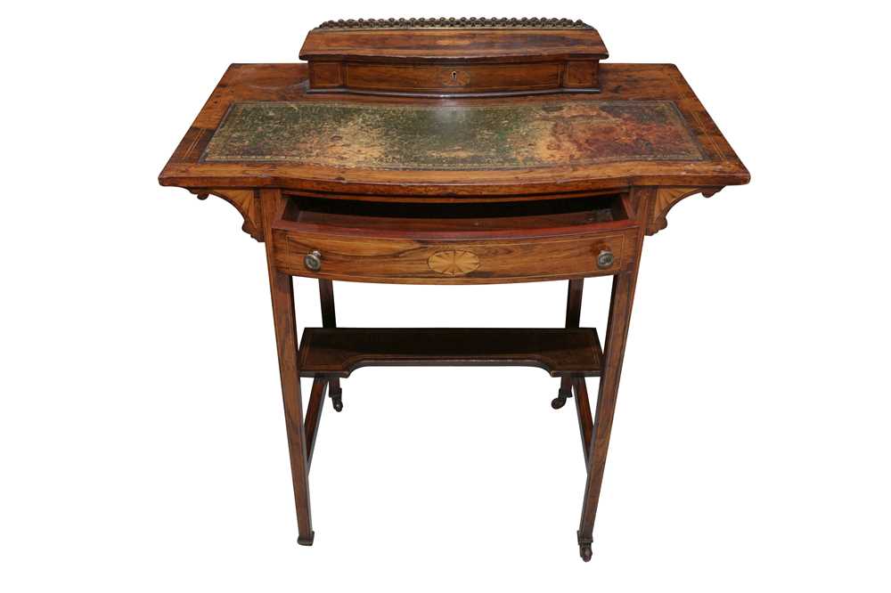 Lot 581 - AN EDWARDIAN SHERATON REVIVAL ROSEWOOD BOW FRONT WRITING TABLE