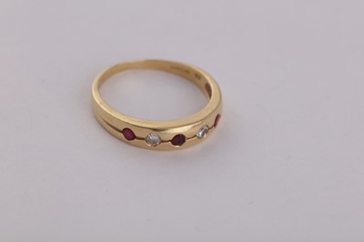 Lot 13 - A FIVE STONE RUBY AND DIAMOND RING