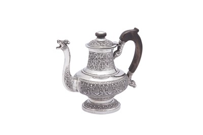 Lot 97 - An early 20th century Ceylonese (Sri Lankan) silver coffee pot, possibly Colombo circa 1920