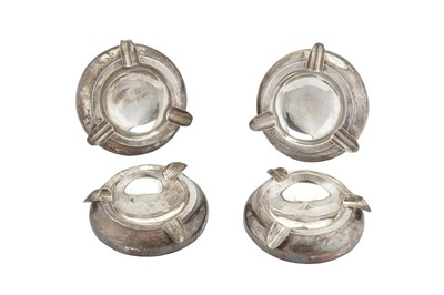 Lot 272 - A SET OF FOUR GEORGE V STERLING SILVER ASHTRAYS, BIRMINGHAM 1922 BY J.C. VICKERY