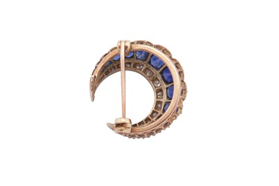 Lot 20 - A sapphire and diamond crescent brooch