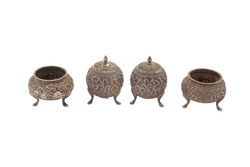 Lot 221 - A LATE 19TH / EARLY 20TH CENTURY ANGLO INDIAN UNMARKED SILVER CRUET SET, CUTCH CIRCA 1900