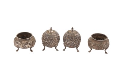 Lot 221 - A LATE 19TH / EARLY 20TH CENTURY ANGLO INDIAN UNMARKED SILVER CRUET SET, CUTCH CIRCA 1900