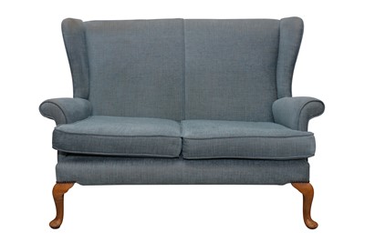 Lot 11 - A WINGBACK TWO SEATER SETTEE