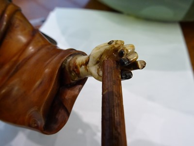 Lot 1113 - A JAPANESE IVORY AND HARDWOOD FIGURE OF A WOOD CUTTER, MEIJI PERIOD