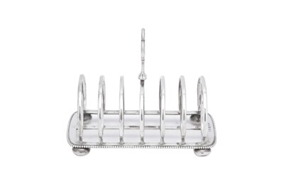 Lot 409 - A Victorian sterling silver seven bar toast rack, Birmingham 1874 by Elkington and Co