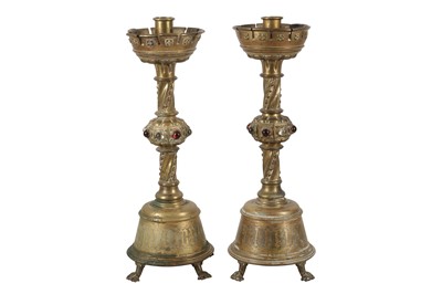 Lot 512 - A PAIR OF VICTORIAN GOTHIC REVIVAL BRASS ECCLESIASTICAL CANDLESTICKS, 19TH CENTURY