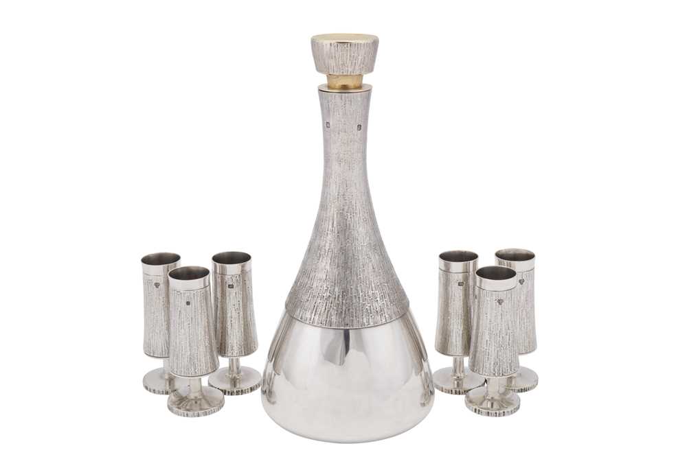 Lot 344 - An assembled Elizabeth II modernist sterling silver drinks suite, the decanter London 1971 by Mappin and Webb