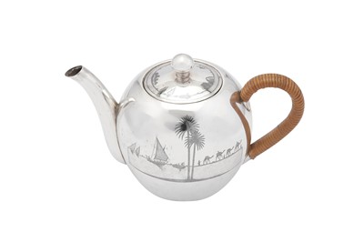 Lot 185 - An early 20th century Iraqi silver and niello teapot, circa 1927-29 signed Omara Shoodod