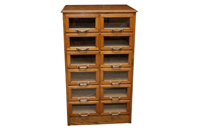 Lot 615 - AN OAK HABERDASHER'S CHEST OF DRAWERS, 20TH CENTURY