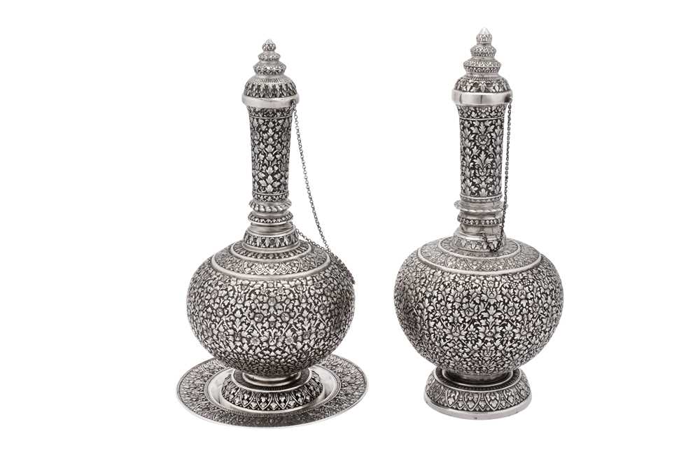 Lot 105 - A pair of late 19th / early 20th century Siamese (Thai) silver bottles (Ratanakosin), probably Bangkok circa 1900