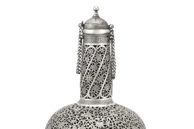 Lot 366 - A RETICULATED AND PIERCED SILVER GLASS BOTTLE