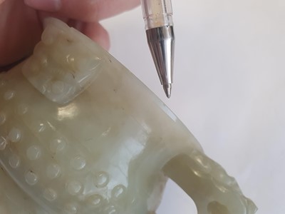 Lot 19 - A CHINESE PALE CELADON JADE ARCHAISTIC CUP.