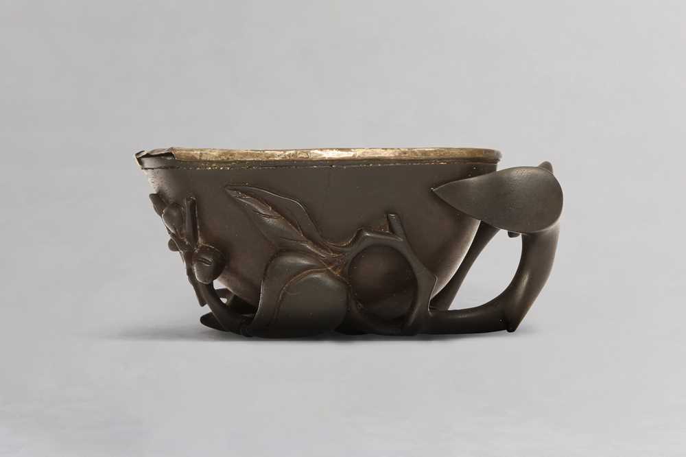 Lot 3 - A CHINESE HARDWOOD 'PEACHES' LIBATION CUP.