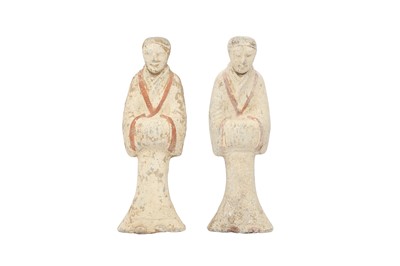 Lot 153 - A NEAR-PAIR OF CHINESE POTTERY FIGURES OF ATTENDANTS.