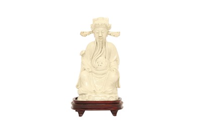 Lot 549 - A CHINESE BLANC-DE-CHINE FIGURE OF CAISHEN.