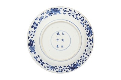 Lot 355 - A CHINESE BLUE AND WHITE DISH AND A CANTON FAMILLE ROSE DISH.