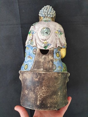 Lot 267 - A CHINESE ENAMELLED AND GILT-DECORATED FIGURE OF A BUDDHA.