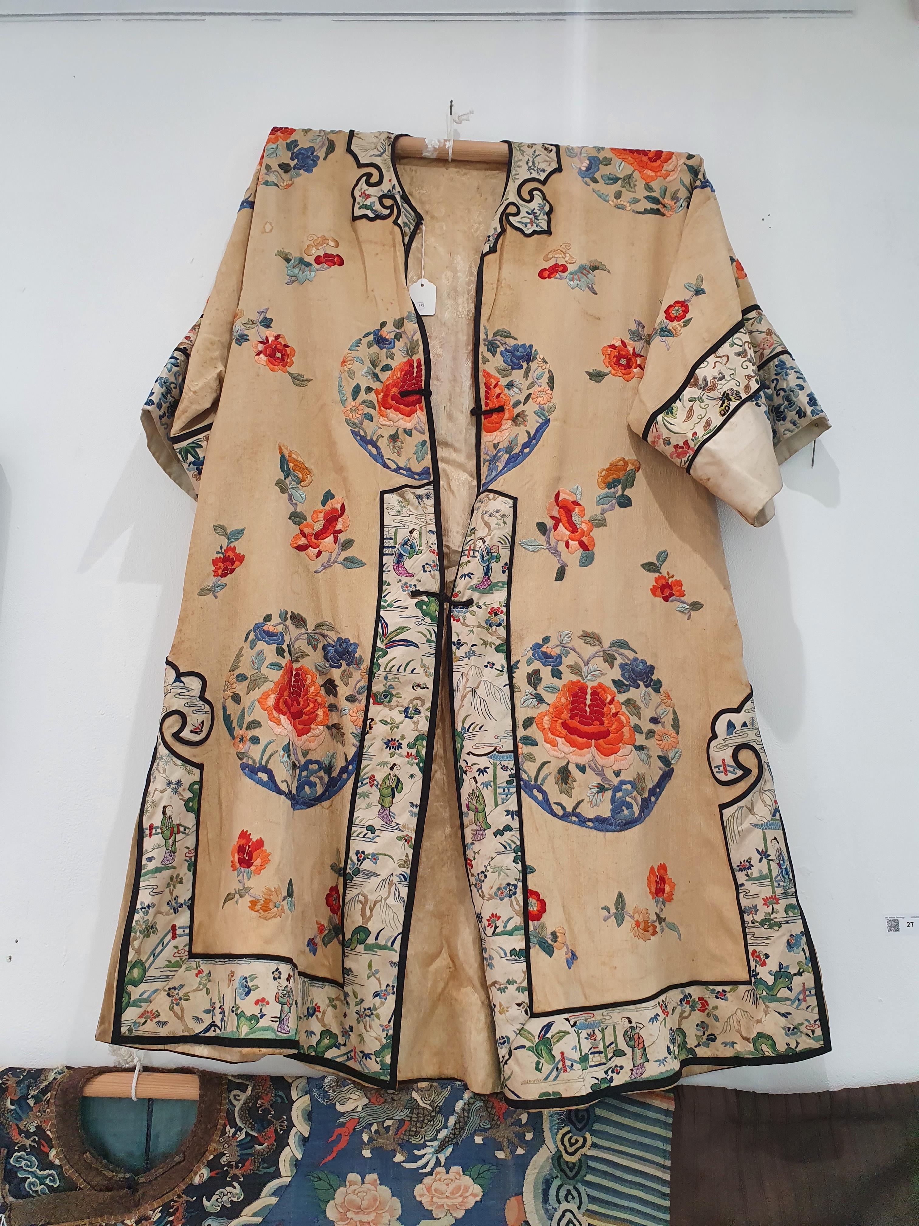 Lot 383 - A CHINESE APRICOT-GROUND EMBROIDERED SILK