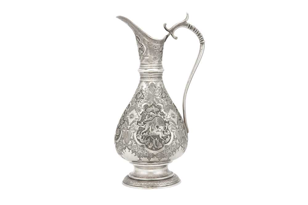 Lot 381 - A LARGE REPOUSSÉ SILVER JUG WITH ANIMALS AND FLORAL DECORATION