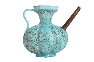 Lot 391 - AN ENGRAVED AND TURQUOISE-GLAZED POTTERY EWER