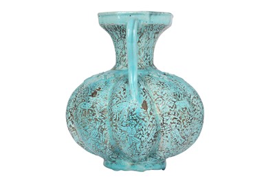 Lot 391 - AN ENGRAVED AND TURQUOISE-GLAZED POTTERY EWER