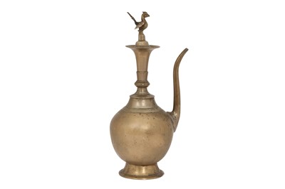 Lot 398 - A 18TH-19TH CENTURY CEREMONIAL BRASS EWER (RASKI) WITH A PEACOCK FINIAL